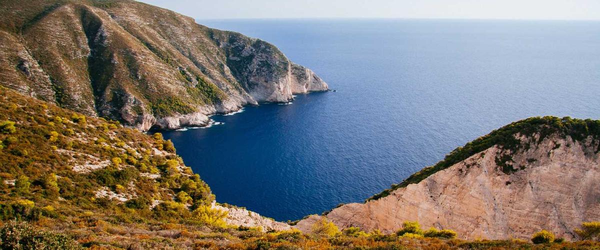 Deep navy blue kitchen island with white perimeter cabinets