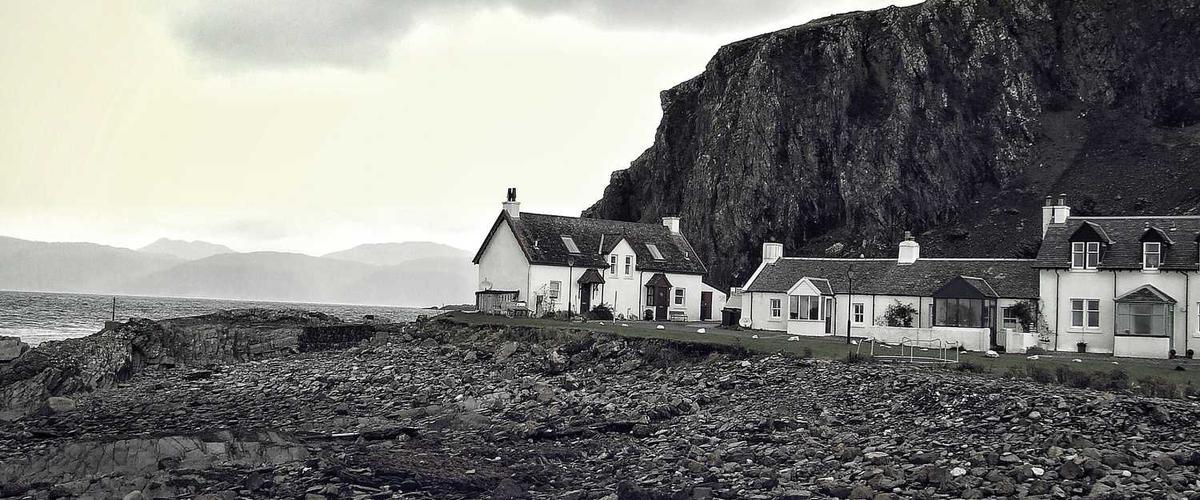 Professional painters preparing stucco exterior for painting