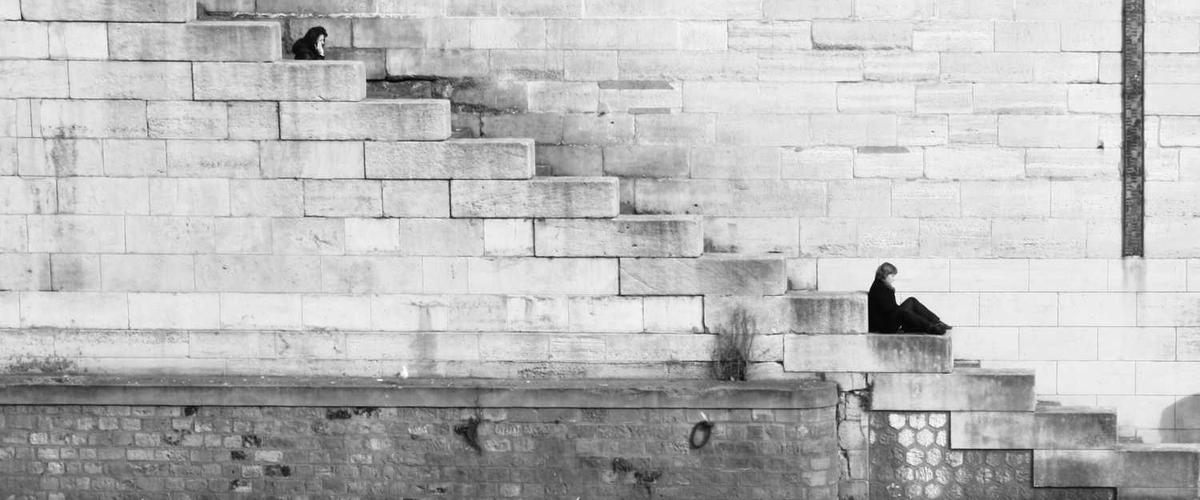 Cans of professional exterior paint brands arranged on work surface